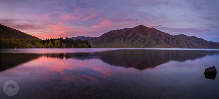 Lake Benmore reflections at sunset panorama, Canterbury, New Zealand
