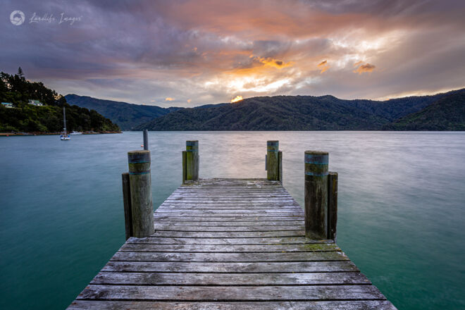 Sunset wharf at Bythells Bay, Marlborough Sounds, New Zealand