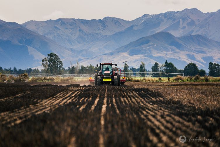 Seed drilling with mountain backdrop, Methven, Canterbury, New Zealand